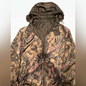High quality wind breaker rain jacket.Black and one side a brown floral design